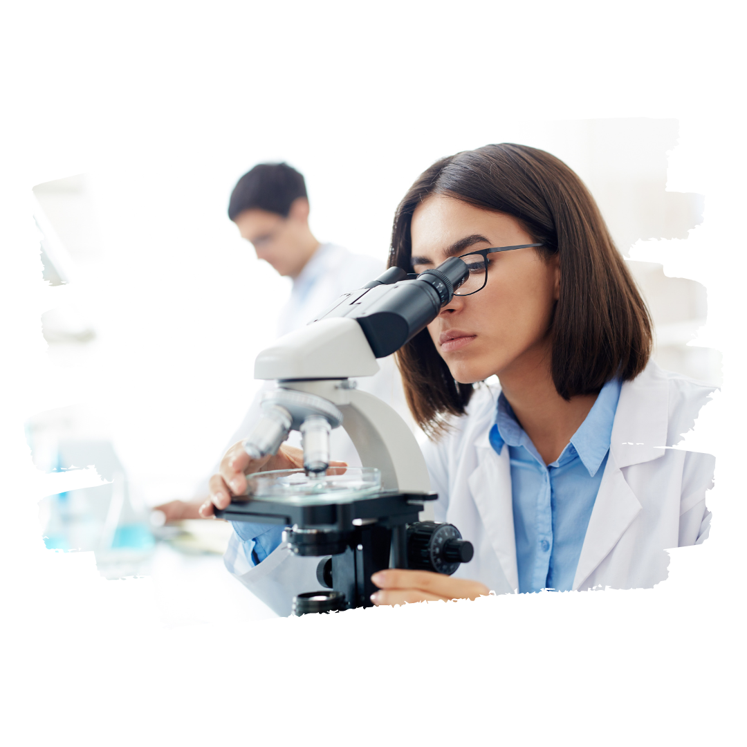 Woman looking with a microscope in a lab Woman looking with a microscope in a lab